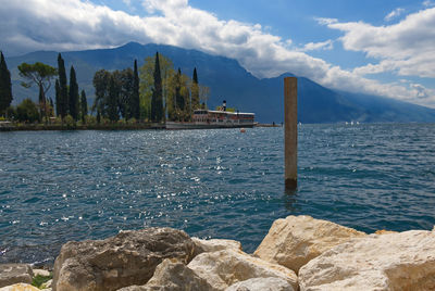 Lake garda, italy - 25 april 2022 panoramic view of the bay and vintage paddle steamer ship italia