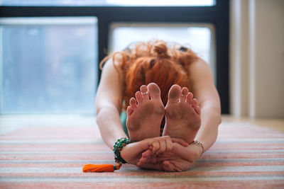 Woman exercising on floor