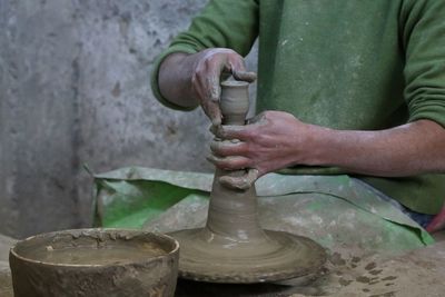 Man shaping pottery