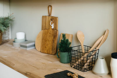 Scandinavian style kitchen utensils. wooden cutting boards, wooden spoons and shovels.