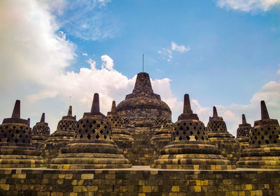 Stupas of building against sky at candi borobudur, yogyakarta, indonesia