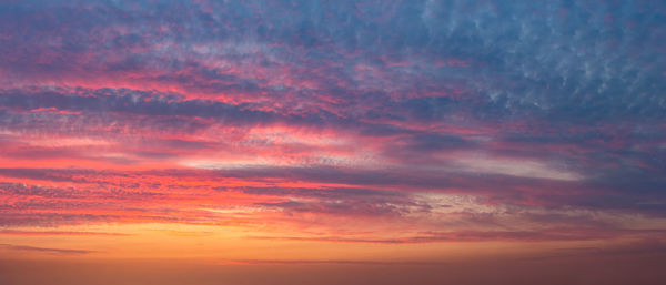 Low angle view of dramatic sky during sunset