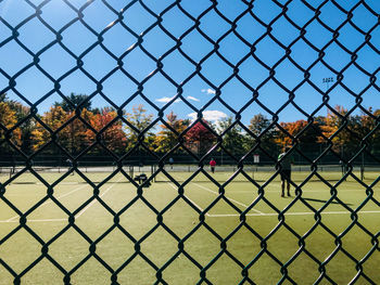 Chainlink fence against sky