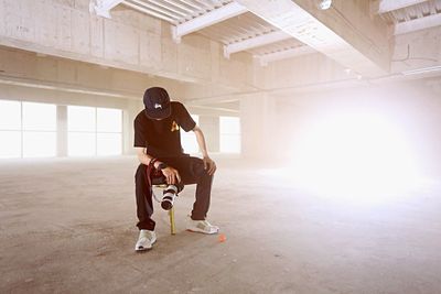 Full length of woman standing by railing