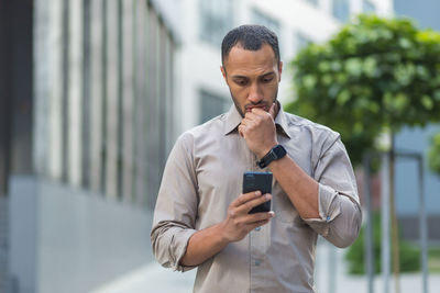 Young man using mobile phone