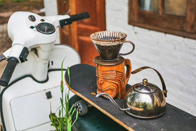 Close-up of old tea cup on table