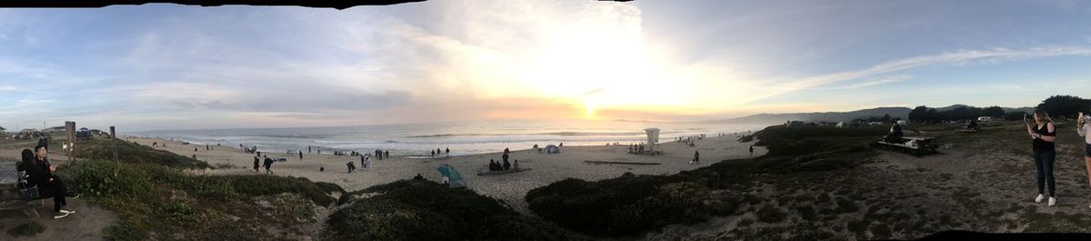 Panoramic view of beach against sky during sunset