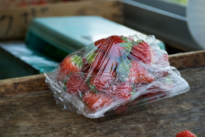 Close-up of strawberries on table at market stall