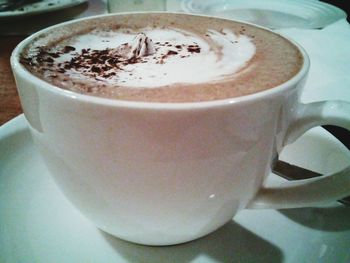 Close-up of coffee cup on table