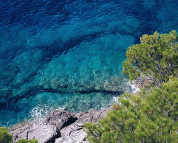 High angle view of sea against blue sky