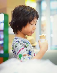 Close-up of boy eating ice cream