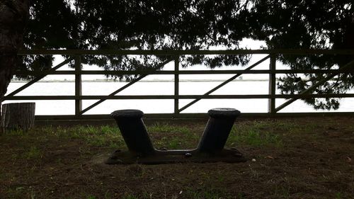 Empty park bench on field