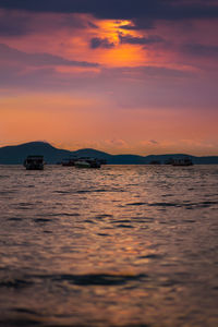 Scenic view of sea against orange sky