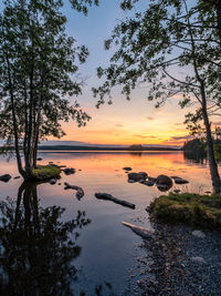 Scenic view of lake against sky during sunset