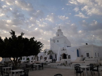 Panoramic view of buildings and trees against sky