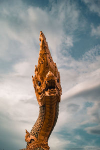 Low angle view of statue against sky