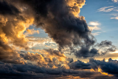 Low angle view of dramatic sky during sunset