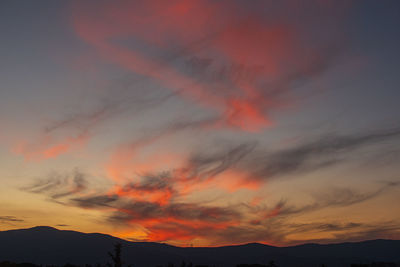 Low angle view of dramatic sky during sunset