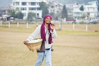 Full length of woman standing on field