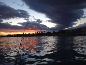Scenic view of lake against cloudy sky