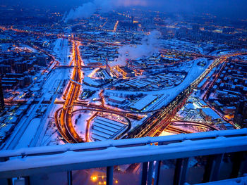 High angle view of illuminated cityscape at night