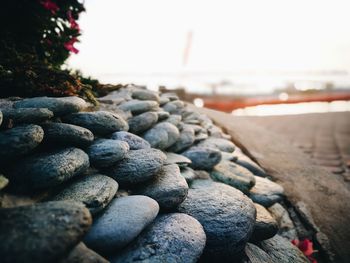 Close-up of pebbles on sand