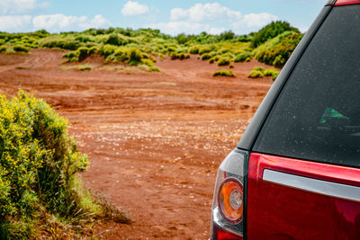 Car in red desert in lefkada, greece