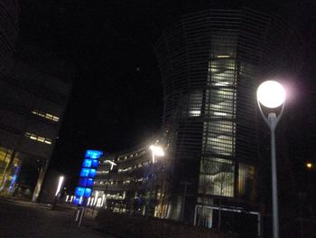 Low angle view of illuminated street light at night