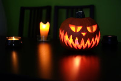 Illuminated candles on pumpkin during halloween