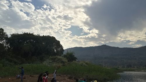 Scenic view of landscape against cloudy sky