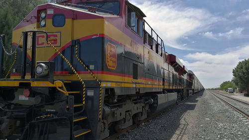 Train on railroad tracks against sky