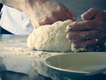 Close-up of person preparing food