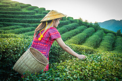 Woman wearing hat on field