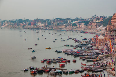 High angle view of boats in sea against clear sky