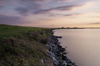 Scenic view of sea against sky during sunset