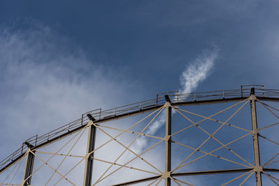 Low angle view of metallic structure against building