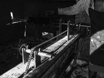 Man working on metal grate