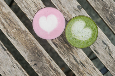 Directly above shot of matcha coffee cups on table