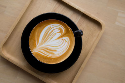 High angle view of cappuccino on table