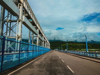 View of bridge against cloudy sky