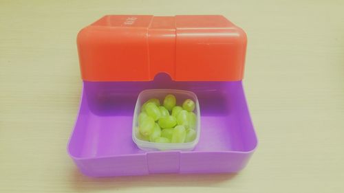 High angle view of grapes in box on table