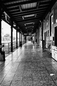 Empty street amidst buildings in city