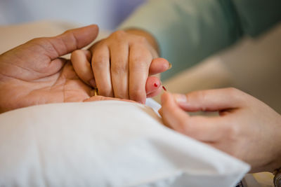 Close-up of hands holding baby feet