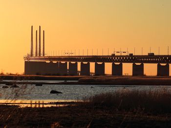 Oresund bridge against clear sky during sunset