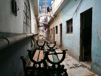 Narrow alley amidst buildings in city