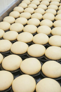 Close-up of dough on baking sheet in kitchen