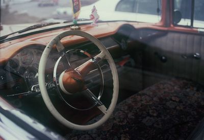 Close-up of car on road