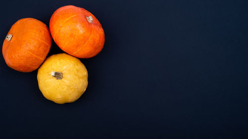 High angle view of oranges on table against black background