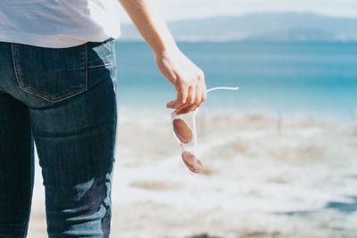 Midsection of man holding hands