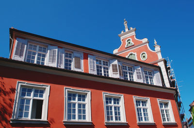 Low angle view of building against blue sky